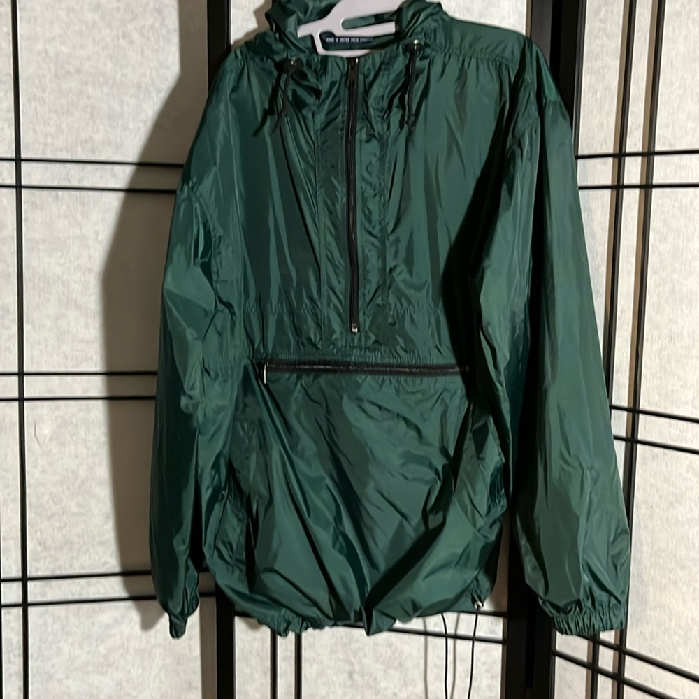 Unisex Rain jacket that folds down  to a pillow